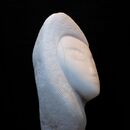 abstract stone carving of a female head