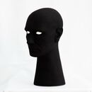 Ernest 3.0 03 a plaster sculpture of a head painted black