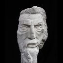 stone carving of man with beard made of white marble