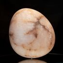 egg-shaped stone carving made of pink alabaster