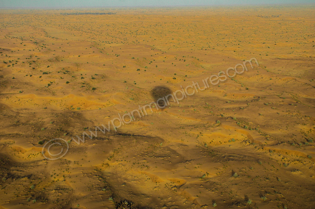 Shadow of Hot air Balloon over desert