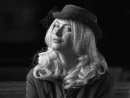Lady In Cocktail Hat by Mick Wells