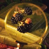 Blackberries and vintage books, still life.