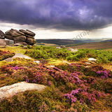 Higger Tor Higger Tor is in the Dark Peak, this is a summer image with a storm rolling along the Burbage valley towards the Tor