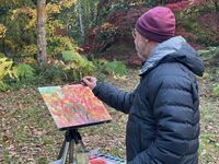 Artist painting acers in the Autumn Garden at Queenswood
