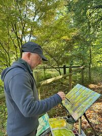 Richard watercolour sketching at Queenswood in early autumn