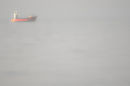 Red boat in the mist