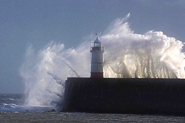 Waves over Newhaven lighthouse