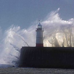 Waves over Newhaven lighthouse