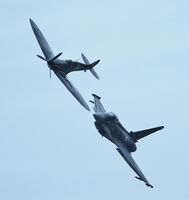 BAE Typhoon FGR4 Ow-RAF ZK349 (BS110-399) & Supermarine Spitfire IIA Ow-RAF P7350 Fly Together At The RAF Fairford Airshow Gloucestershire UK 2019 Order Number FT&S-37