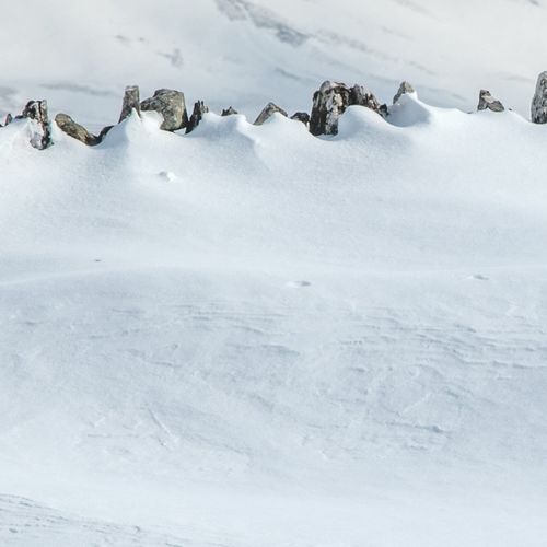 DRY STONE WALL HIDDEN UNDER A BLANKET OF SNOW