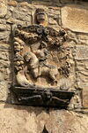 Decorative stone carving of knight in armour on horseback