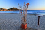 Beach café ornament at Les Lecques, evening, Pointe Grenier in distance