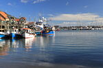 Scarborough harbour in winter with reflections of fishing boats