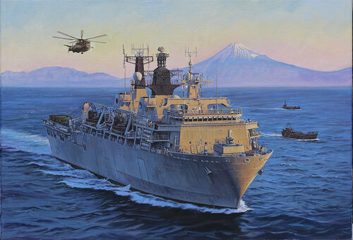 HMS Albion at sea with Mount Fuji in the background and the sun going down.