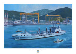 RFA Tideforce leaving Okpo dockyard in South Korea with yellow gantries and green hill behind and tugs by the tanker.