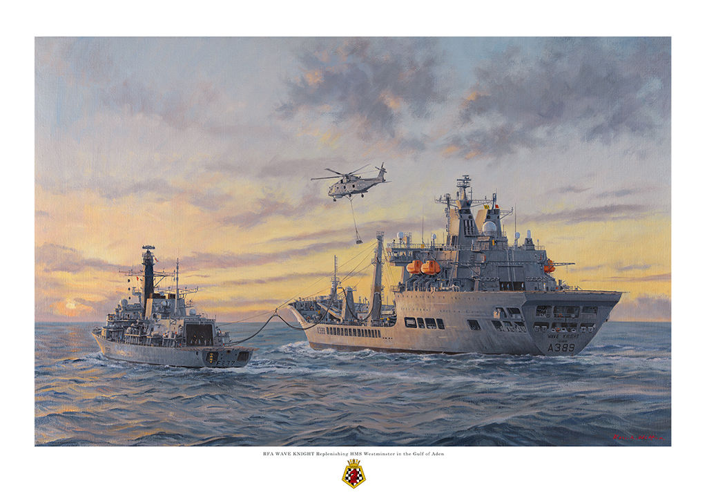 RFA Wave Knight retelling HMS Westminster in the Gulf heading into a sunset sky with Merlin helicopter carrying stores overhead
