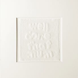 white image of letters imprinted on kitchen roll, about mother artists in lockdown