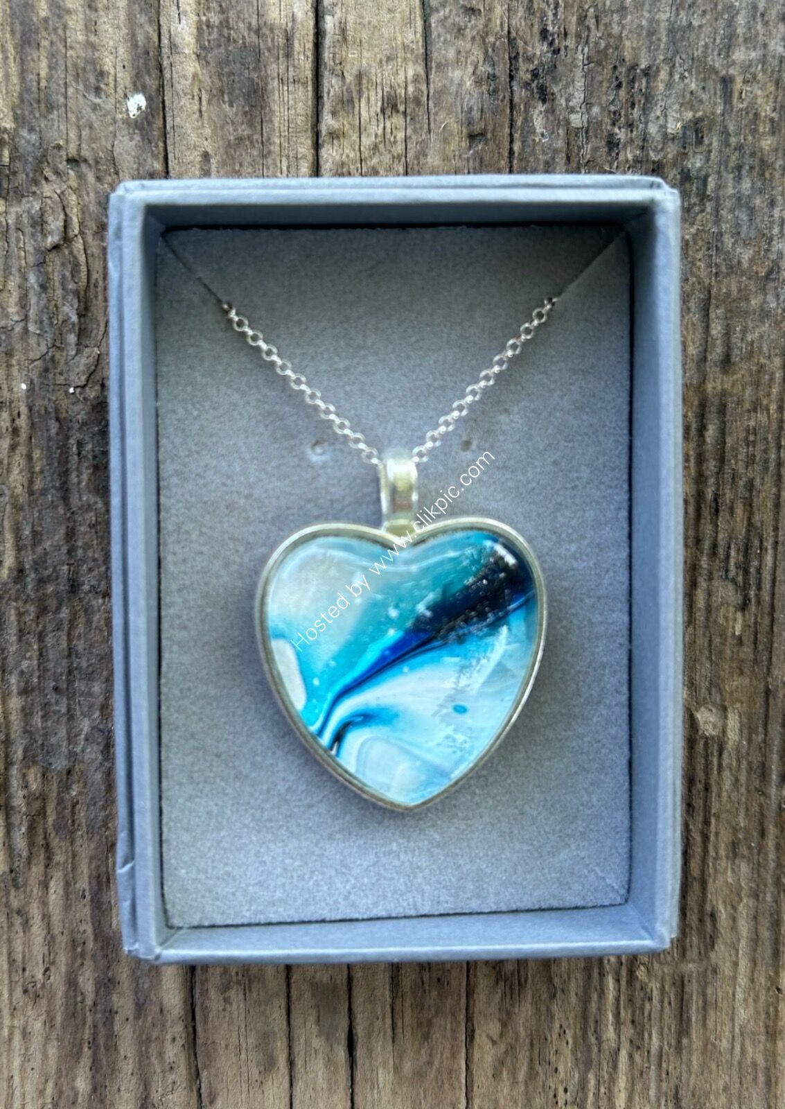 Blue swirl heart pendant