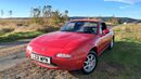 Red 1994 Mazda Eunos 1.8