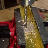 Drilling fixing holes in a T-bar