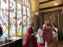 The Bishop blesses the new window.