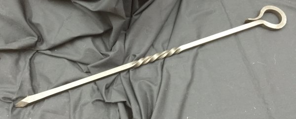 Short fire poker in blackened hand forged iron
