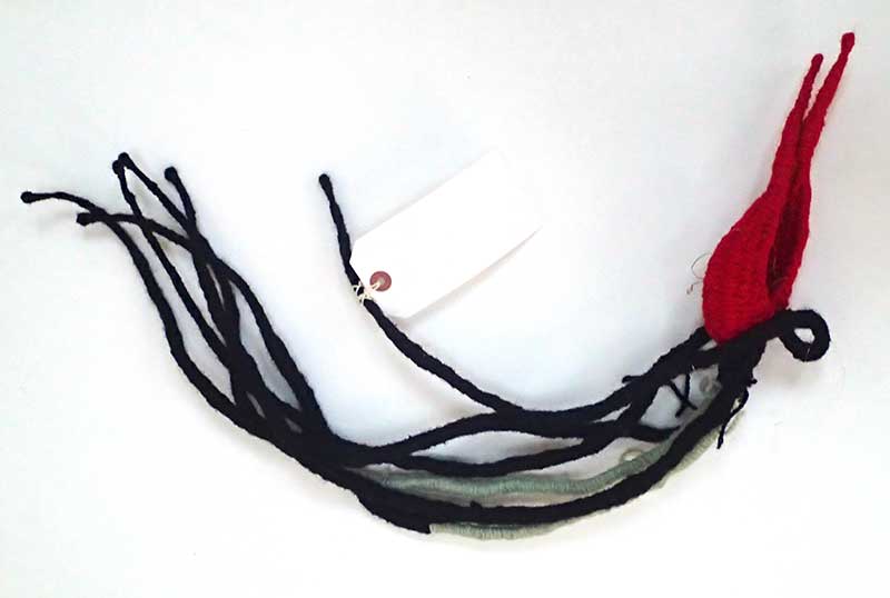 Red Grey and black textile by Tadek Beutlich