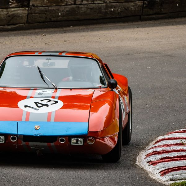 Best of British 2019, Shelsley Walsh, #68 red and blue classic porsche race car attacking shelsley walsh at speed