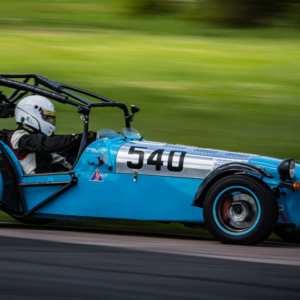 Lotus 7 Club Speed Championships, Curborough, #17 Blue caterham 7 at speed approaching flag pole corner at curborough sprint course