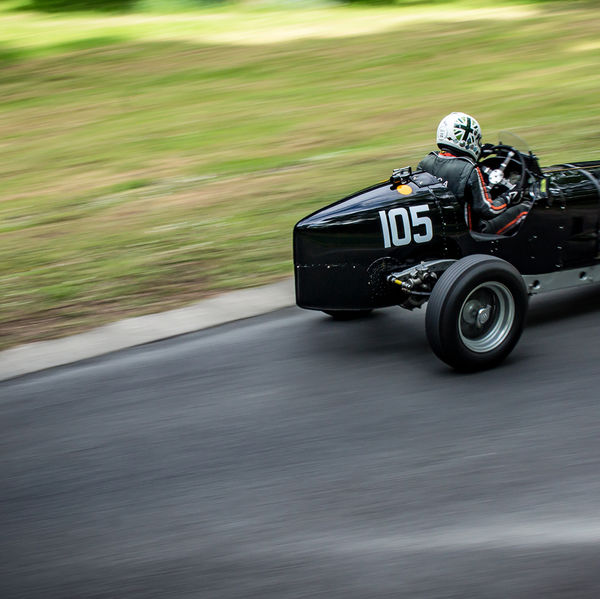 La Vie en Bleu 2019, Prescott Speed Hill Climb, #50 black ERA vintage single seat sports car at speed on prescott hill climb course
