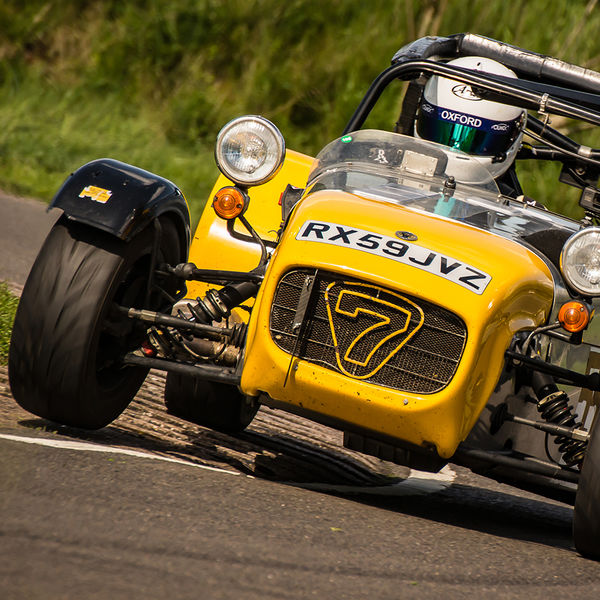 Lotus 7 Club Speed Championships, Curborough, #52 aluminium and yellow caterham 7 rounding the fradley hairpin corner at curborough sprint track