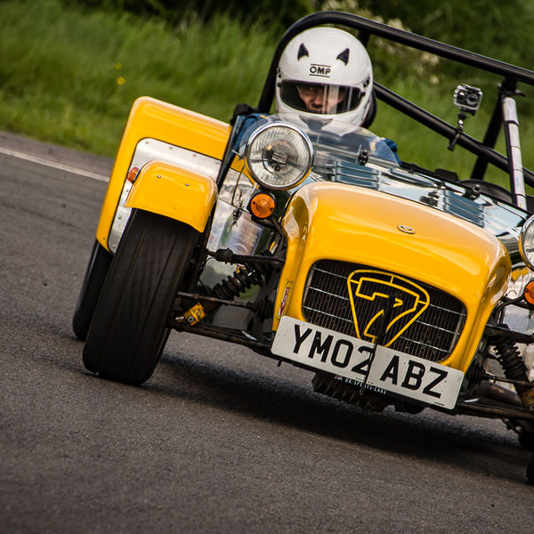 Lotus 7 Club Speed Championships, Curborough, #42 yellow and aluminium caterham 7 rounding the fradley hairpin corner at curborough sprint track