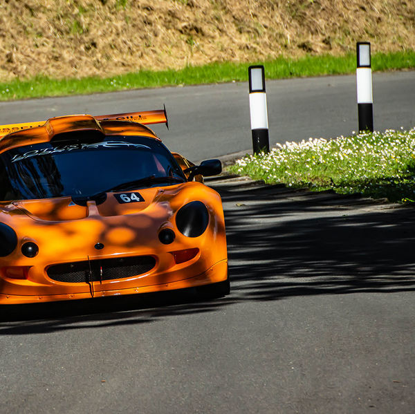 Porsche at Prescott 2019, #26 orange lotus elise at speed during the porsche at prescott hill climb event