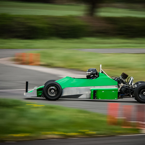 Curborough Sprint Championship 2019 - Round One - #30 green motorcycle engined race car at speed through molehill corner at curborough sprint track