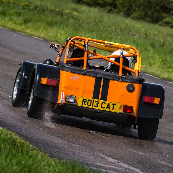 British Motorsports Marshals Sprint, Curborough Sprint Course, #11 Orange Lotus 7 Caterham Westfield opposite lock in rain at Curborough Sprint Course