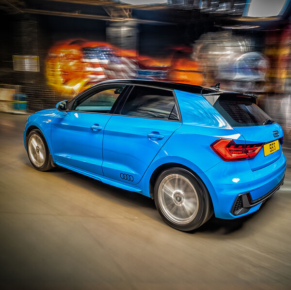 ssshoot-automotive-rigshot-01052021-002 blue audi a1 shot at speed with in birmingham car park with graffiti background