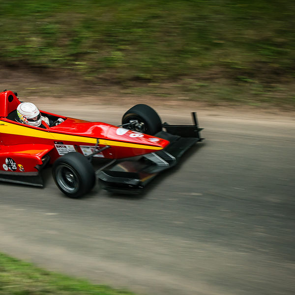 Best of British 2019, Shelsley Walsh, #38 red and yellow single seat racing car on shelsley walsh hill climb at speed