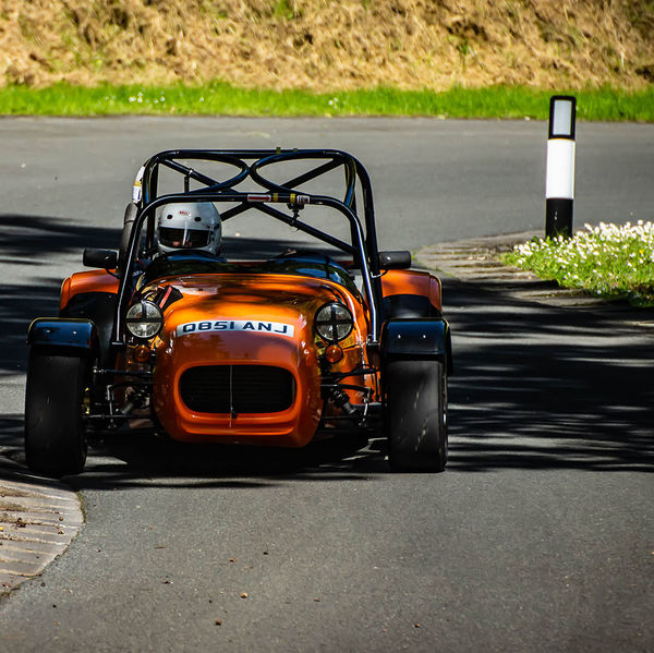 Porsche at Prescott 2019, #32 orange lotus 7 caterham westfield at speed during the porsche at prescott hill climb event