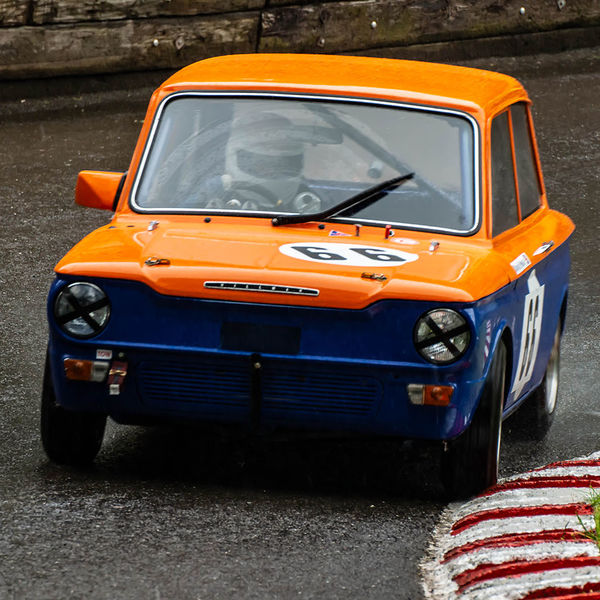 Classic Nostalgia 2019, Shelsley Walsh Hill Climb, #43 orange and blue hillman imp racing car at speed on shelsley walsh hill climb circuit