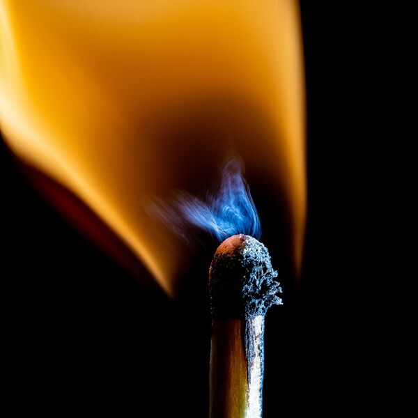 steve-shelley-ssshoot-covid-lockdown-005 match at the moment of ignition with blue and orange flames