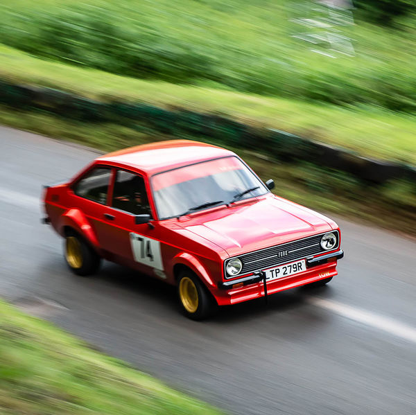 Classic Nostalgia 2019, Shelsley Walsh Hill Climb, #07 red mark two ford escort racing car at speed on shelsley walsh hill climb circuit