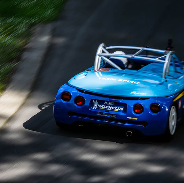 Porsche at Prescott 2019, #66 blue renault sport spider at speed during the porsche at prescott hill climb event