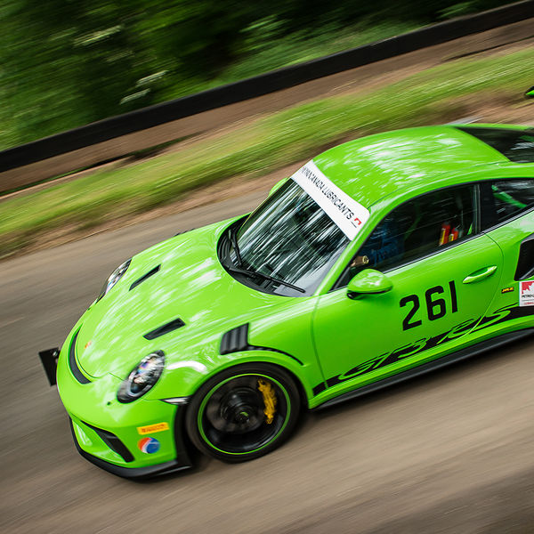 Best of British 2019, Shelsley Walsh, #45 green porsche GT3 RS race car decending shelsley walsh hill climb at speed