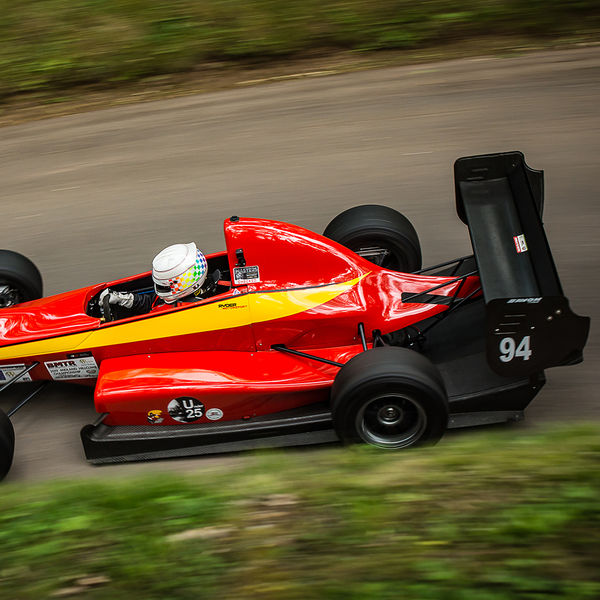 Best of British 2019, Shelsley Walsh, #42 red and yellow single seat racing car descending shelsley walsh hill climb at speed