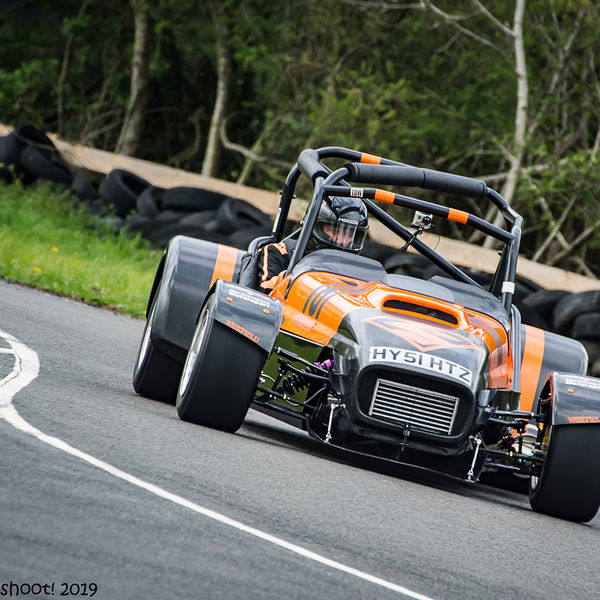 Curborough Sprint Championship 2019 - Round One - #31 orange and black lotus 7 caterham westfield at speed through molehill corner at curborough sprint track