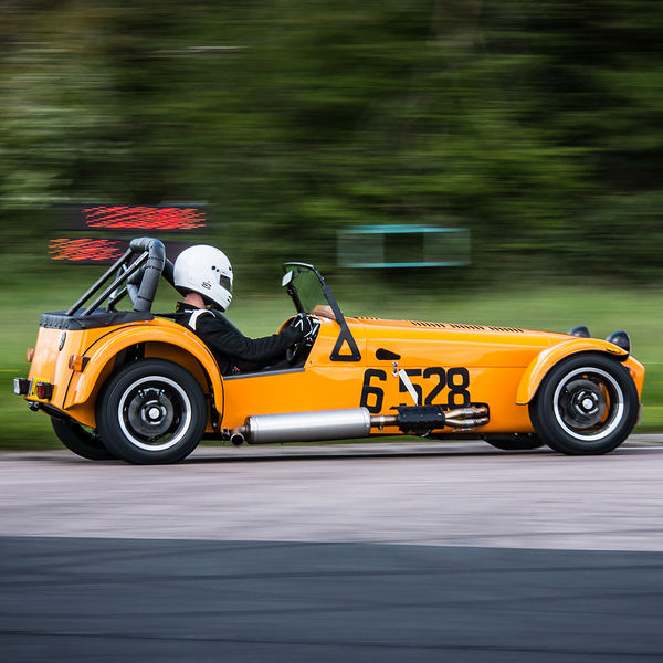 Lotus 7 Club Speed Championships, Curborough, #12 Orange Caterham 7 at speed through flag pole corner at shenstone sprint course