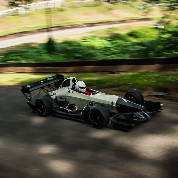 Best of British 2019, Shelsley Walsh, #10 pale green single seat racing car through the essess at shelsley walsh hill climb at speed