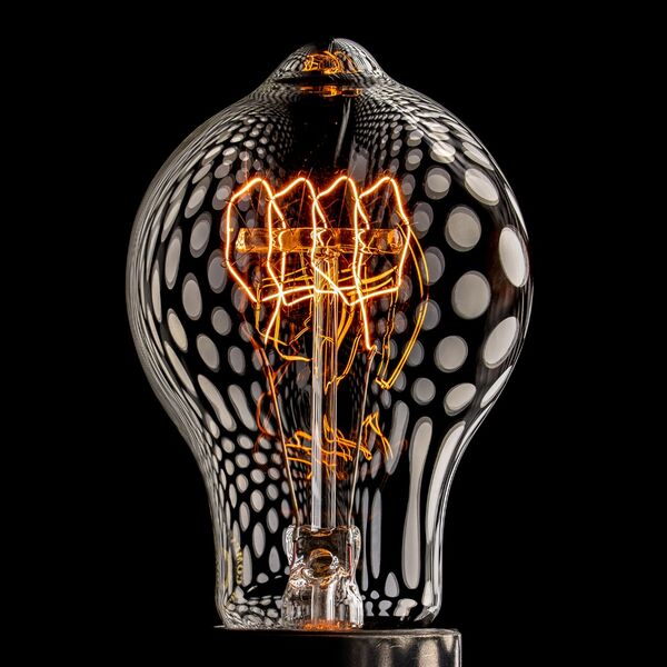 steve-shelley-ssshoot-covid-lockdown-017 vintage light bulb with orange filament and polka dot reflections