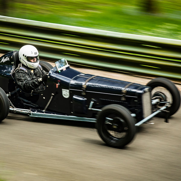 La Vie en Bleu 2019, Prescott Speed Hill Climb, #37 black vintage racing car at speed during prescott hill la vie en bleu event 2019